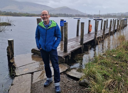 A photo of Christie fundraiser David Battersby in front of Derwent Water reservoir.