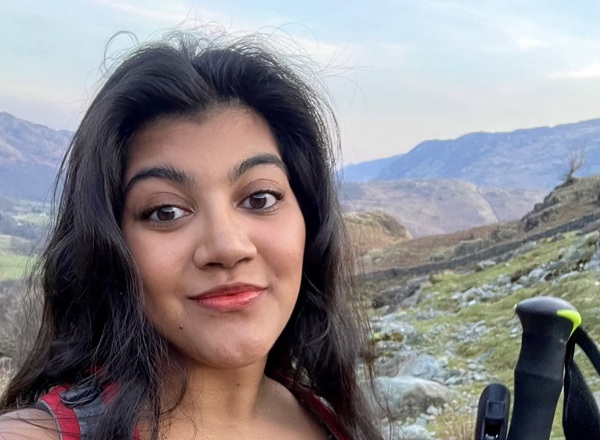 A photo of Christie patient Demisha Patel standing on a hill.