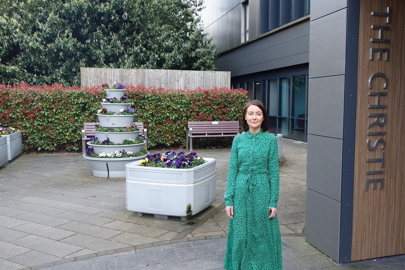 A photo of Christie patient Sarah on her first day of treatment outside The Christie proton beam therapy centre.