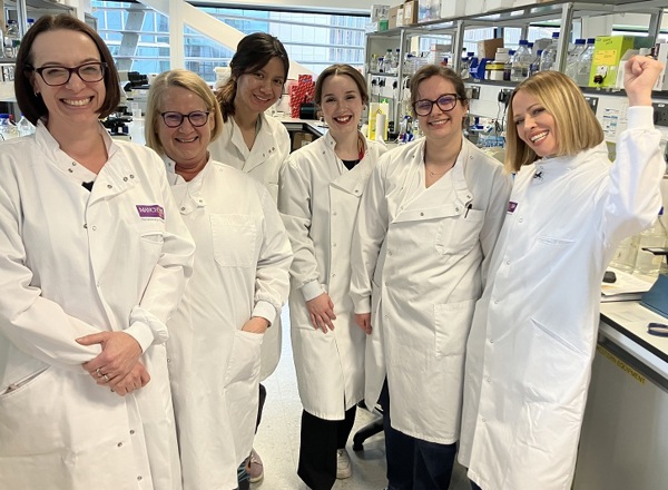 A photo of Girls Aloud star Kimberley Walsh with members of the BCAN-RAY research team at The Christie.