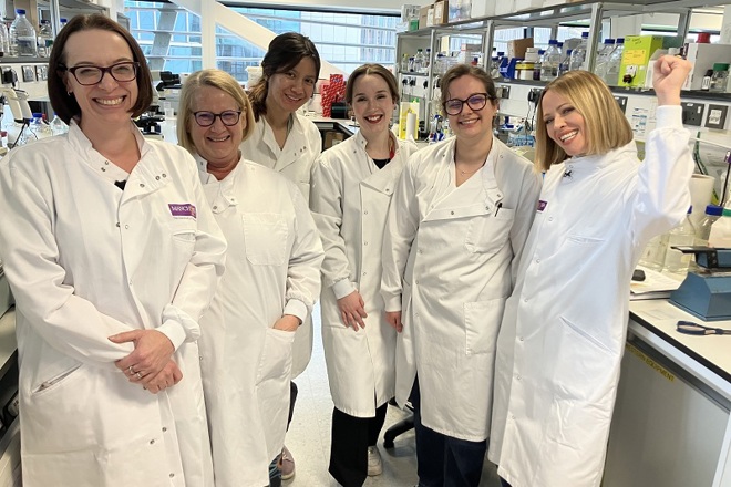 A photo of Girls Aloud star Kimberley Walsh with members of the BCAN-RAY research team at The Christie.