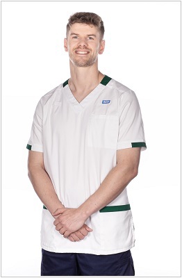 A photo of an occupational therapist wearing a uniform in white with dark green trim.