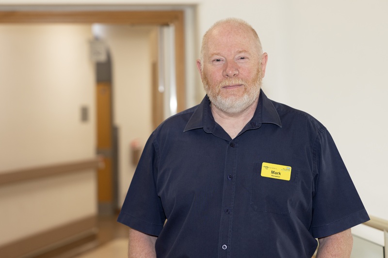 A photo of Mark Hillman, receptionist in the blood room at The Christie.
