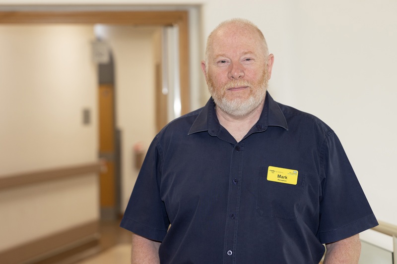 A photo of Mark Hillman, receptionist in the blood room at The Christie.