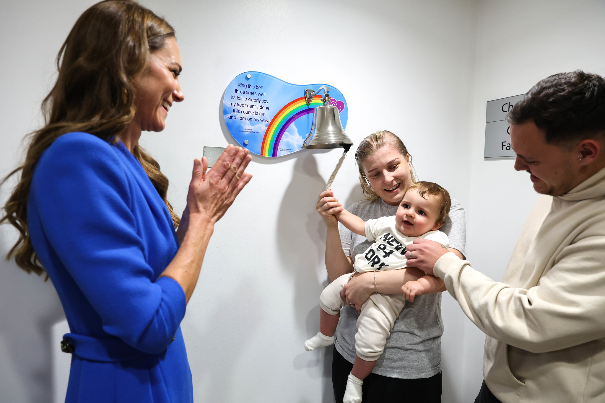 A photo of the Princess of Wales visiting The Christie and watching a patient ring the end of treatment bell.