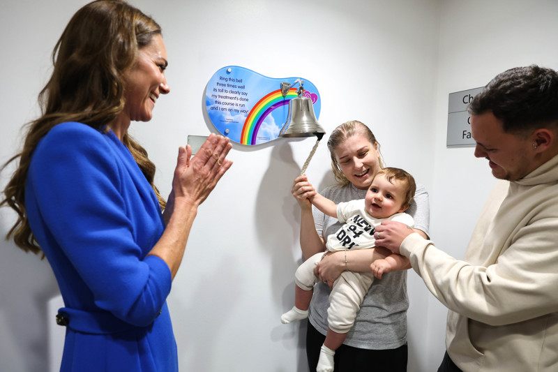 A photo of the Princess of Wales visiting The Christie and watching a patient ring the end of treatment bell.