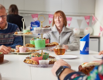 A photo of a group of Christie Charity fundraisers having afternoon tea.