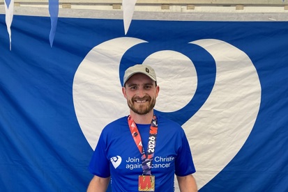 A photo of Christie Charity fundraiser Tom Reade after completing the Manchester Marathon 2026.