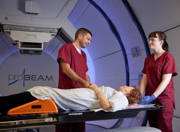 Proton beam therapy, gantry, PBT patient, Superintendent radiographer, David Kirk, Radiographer, Angela Hill, Pan Artists, Patricia Dawson, September 2022