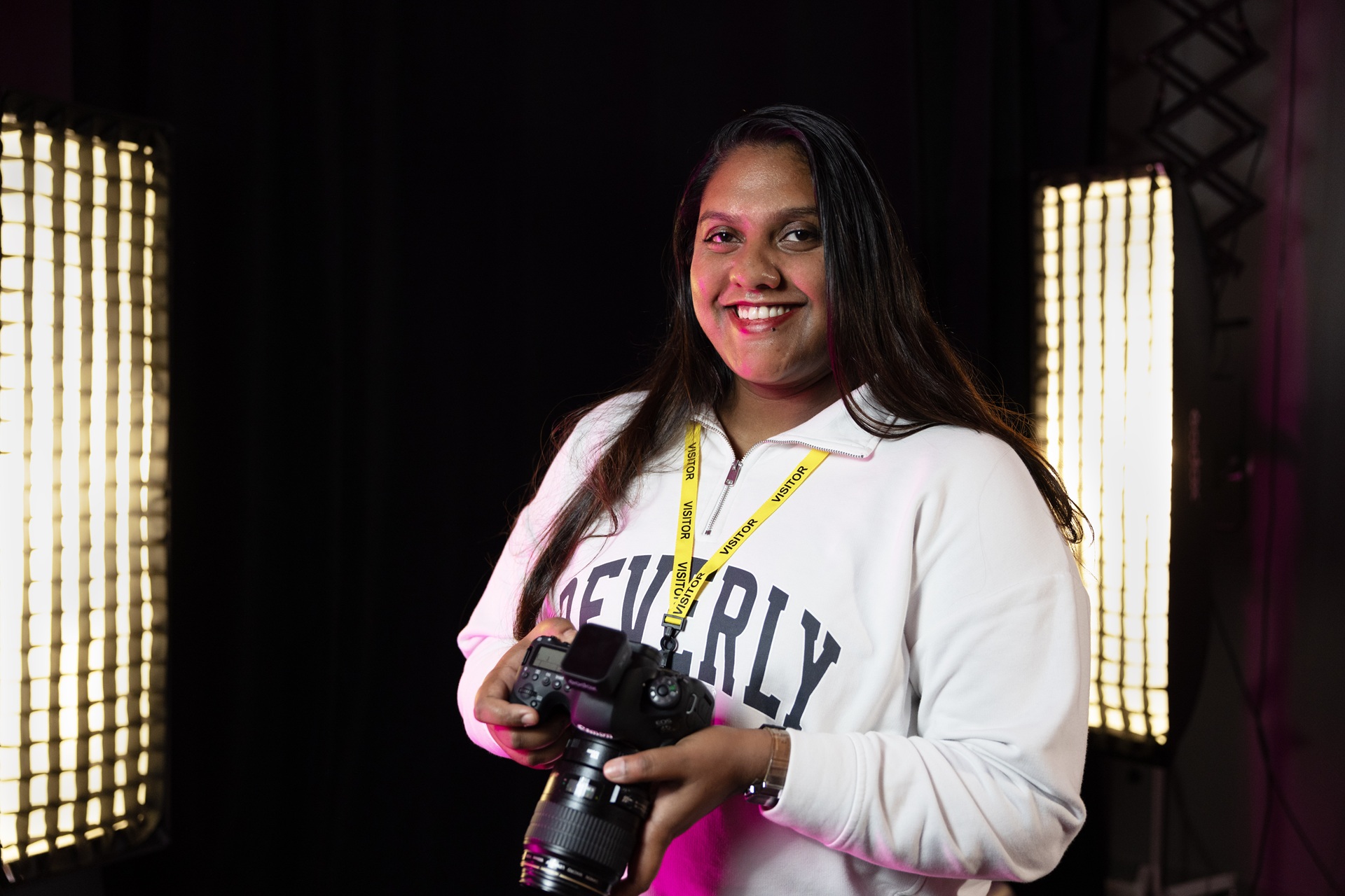 A photo of work experience student Krishnapriya holding a camera on a placement with The Christie's Medical Illustration Team.