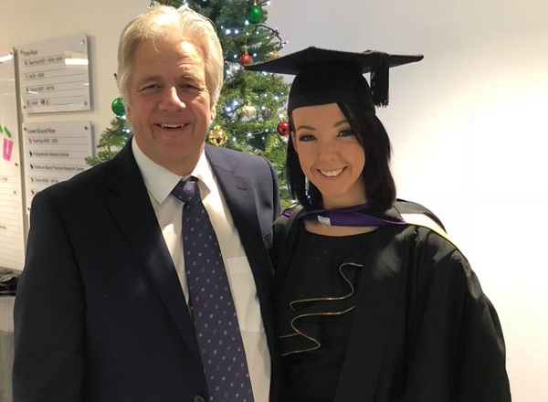 A photo of Sarah with her dad David at her graduation.