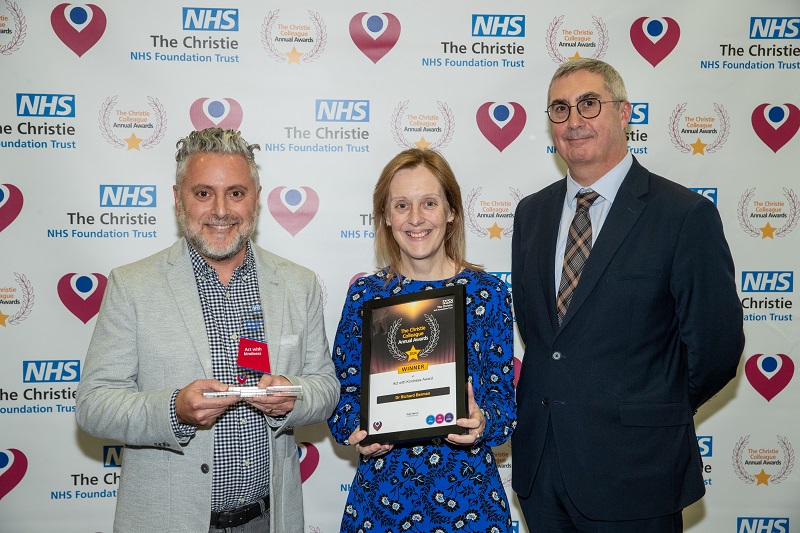 Dr. Richard Berman receiving his Christie Colleague Award from Christie Chief Executive Roger Spencer and his patient, Helen Hyndman.