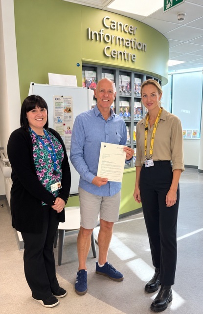 A photo of Dr Faye Sharpley with patient Ivan McKeever and secretary Clare Ellis.