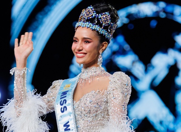 A photo of Miss World Opal Suchata Chuangsri wearing a sash and crown, and waving.
