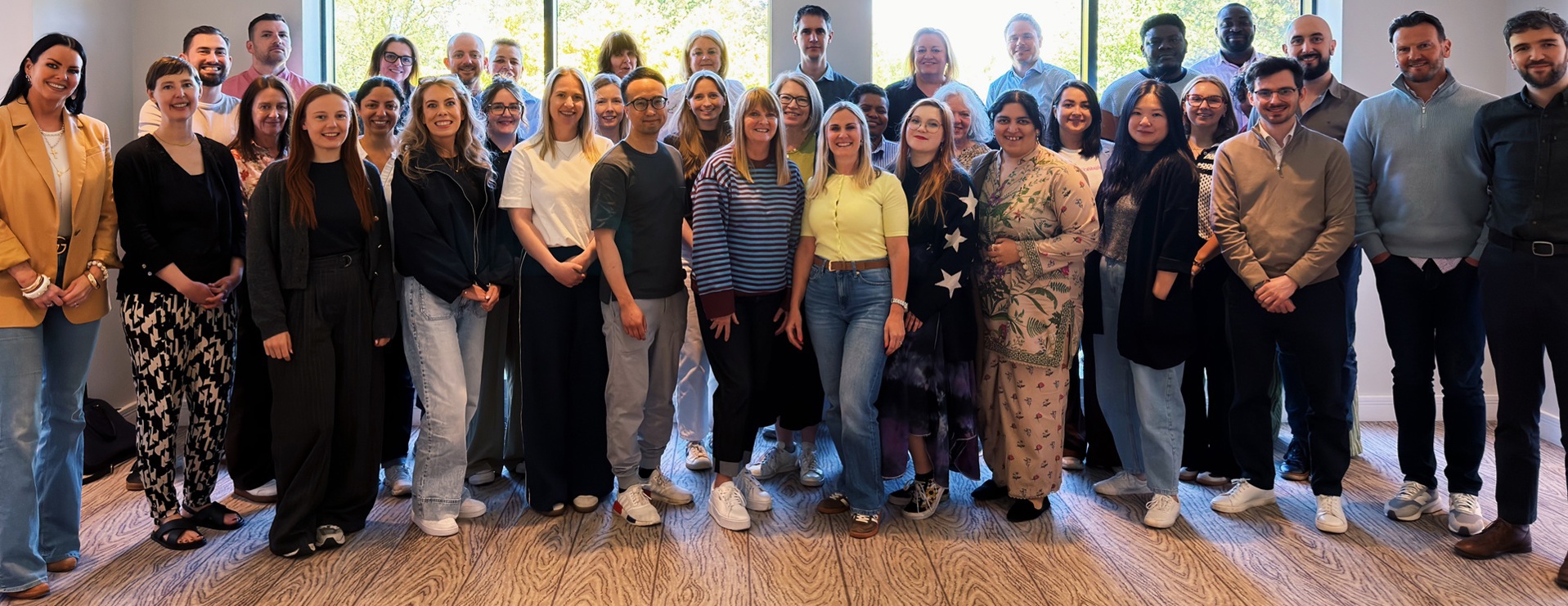 A photo of The Christie Charity staff members all standing in a group, comprising 36 people.