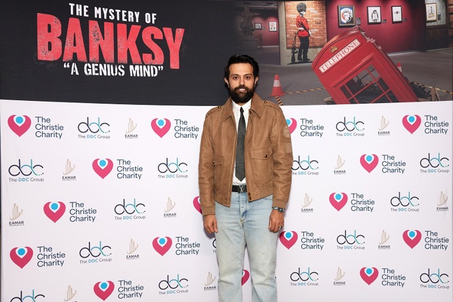 A photo of Dr Abdullah Bin Saleh Alnaeem, Chairman and Philanthropist at Eamar Developments (UK) Ltd at The Mystery of Banksy – A Genius Mind exhibition.