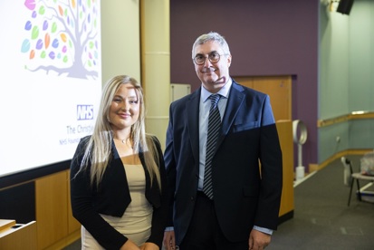 A photo of Christie patient Olivia with The Christie's chief executive Roger Spencer.