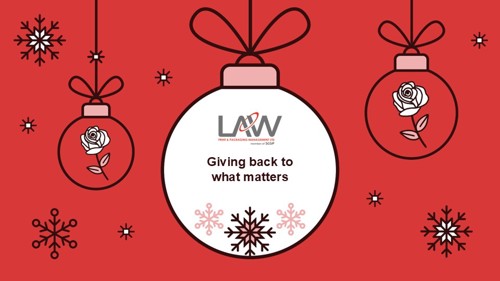 A Christmas bauble graphic reading 'Law: Giving back to what matters'.