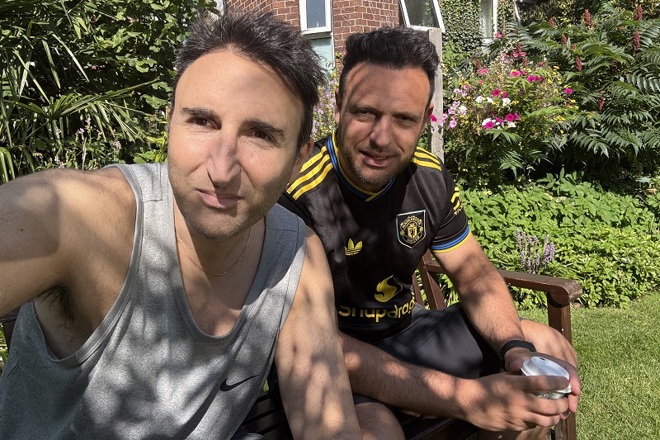 A photo of Christie patient John Blackston and his brother David in The Christie garden.