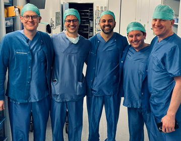 A photo of Christie urology surgeons Mr Arie Parnham, Mr Jeremy Oates, and Mr Aziz Gulamhusein, together with penile cancer fellow Kenneth Patterson visiting a former fellow in Switzerland to see how his practice has evolved.