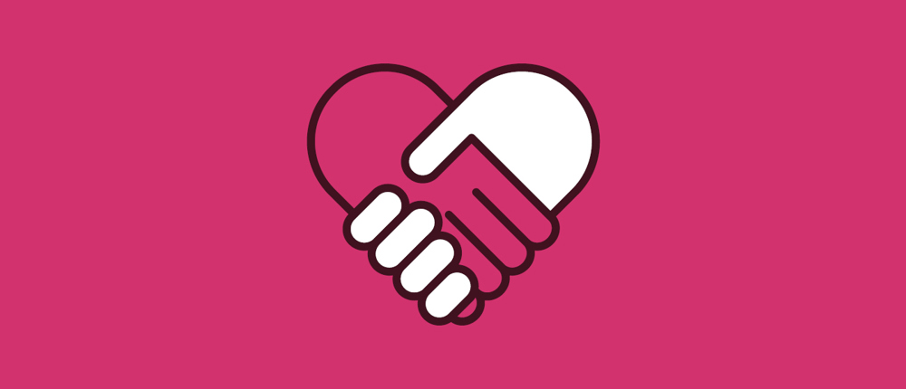A graphic showing a handshake in the shape of a heart.