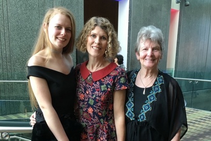A photo of Christie fundraiser Juliet Hardy-Wilson with her daughter Bea and her mum either side of her.