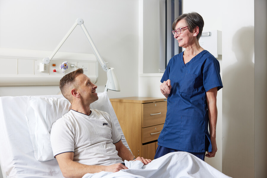 Nurse next to patient in bed, Clinical research facility, CRF manager, Helen Donovan, Pan Artists, Karl Conway, November 2022
