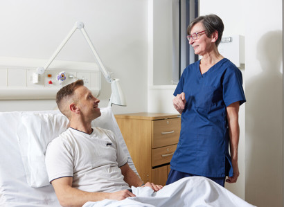 Nurse next to patient in bed, Clinical research facility, CRF manager, Helen Donovan, Pan Artists, Karl Conway, November 2022