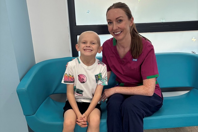 A photo of Christie patient Coby Kings sitting next to Penelope Hart-Spencer, a health play specialist at The Christie