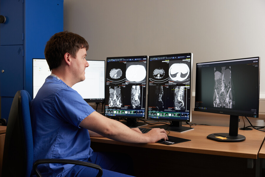 Radiology. Radiologist, reviewing scans, Dummy screens, September 2022, Brian Moloney