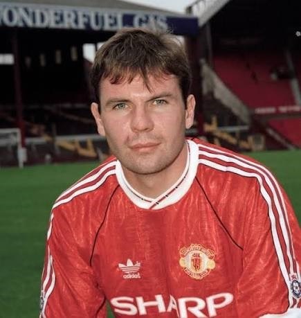 A photo of footballer Brian McClair wearing a Manchester United shirt in the 1990s.