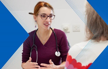 A photo of a female consultant talking to a female patient, who is out of view.