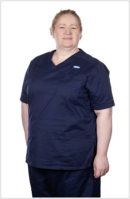 A photo of a team leader wearing a uniform in navy with matching navy trim.