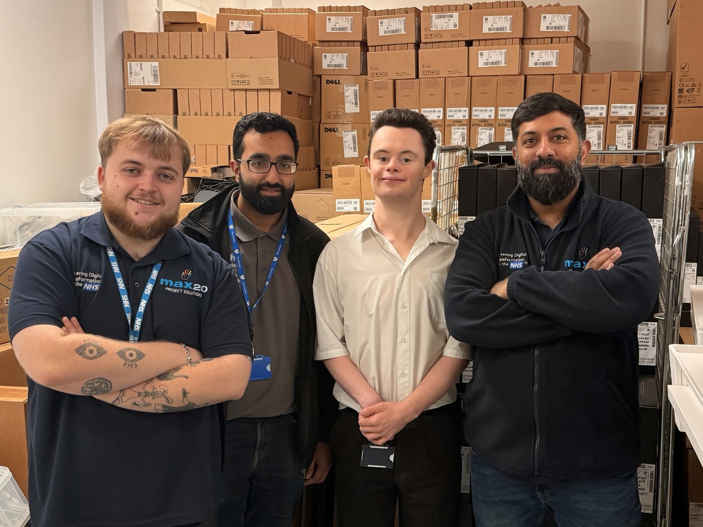 A photo of Christie work experience student Joe with Aamir, Jake and Mohamed from the Digital Refresh Team.