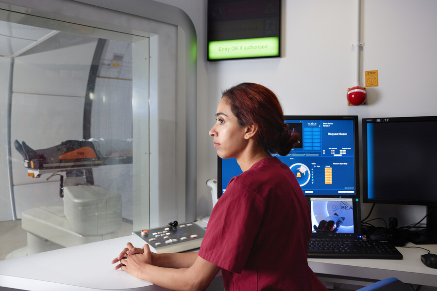 Proton beam therapy, gantry, PBT patient, Radiographer, Adeeba Halim, Pan Artists, Ian Aston, September 2022