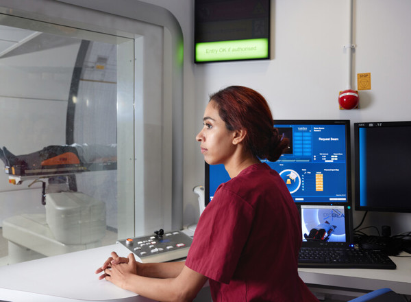 Proton beam therapy, gantry, PBT patient, Radiographer, Adeeba Halim, Pan Artists, Ian Aston, September 2022